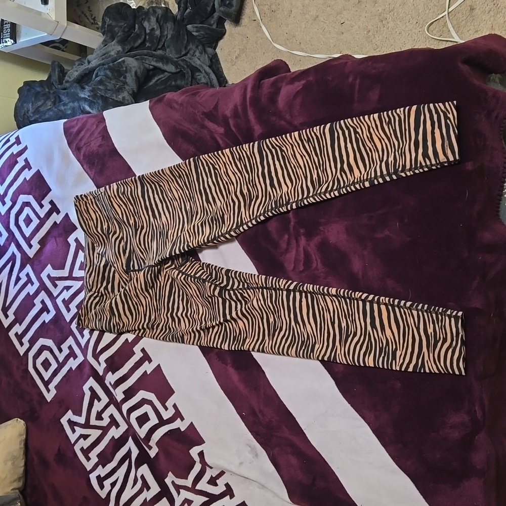 Leggings , tigar stripe colors of tan and black, size medium